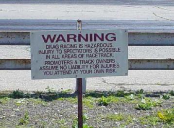 Warning! Drag racing is hazardous sign...